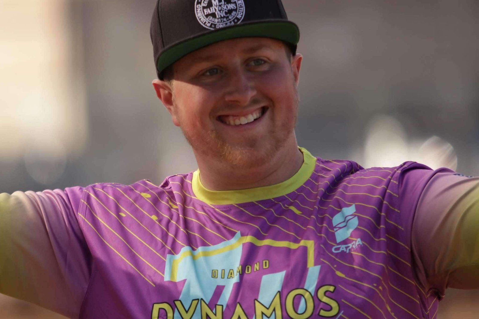 Smiling Diamond Dynamos player in a custom Capra Sports sublimated jersey