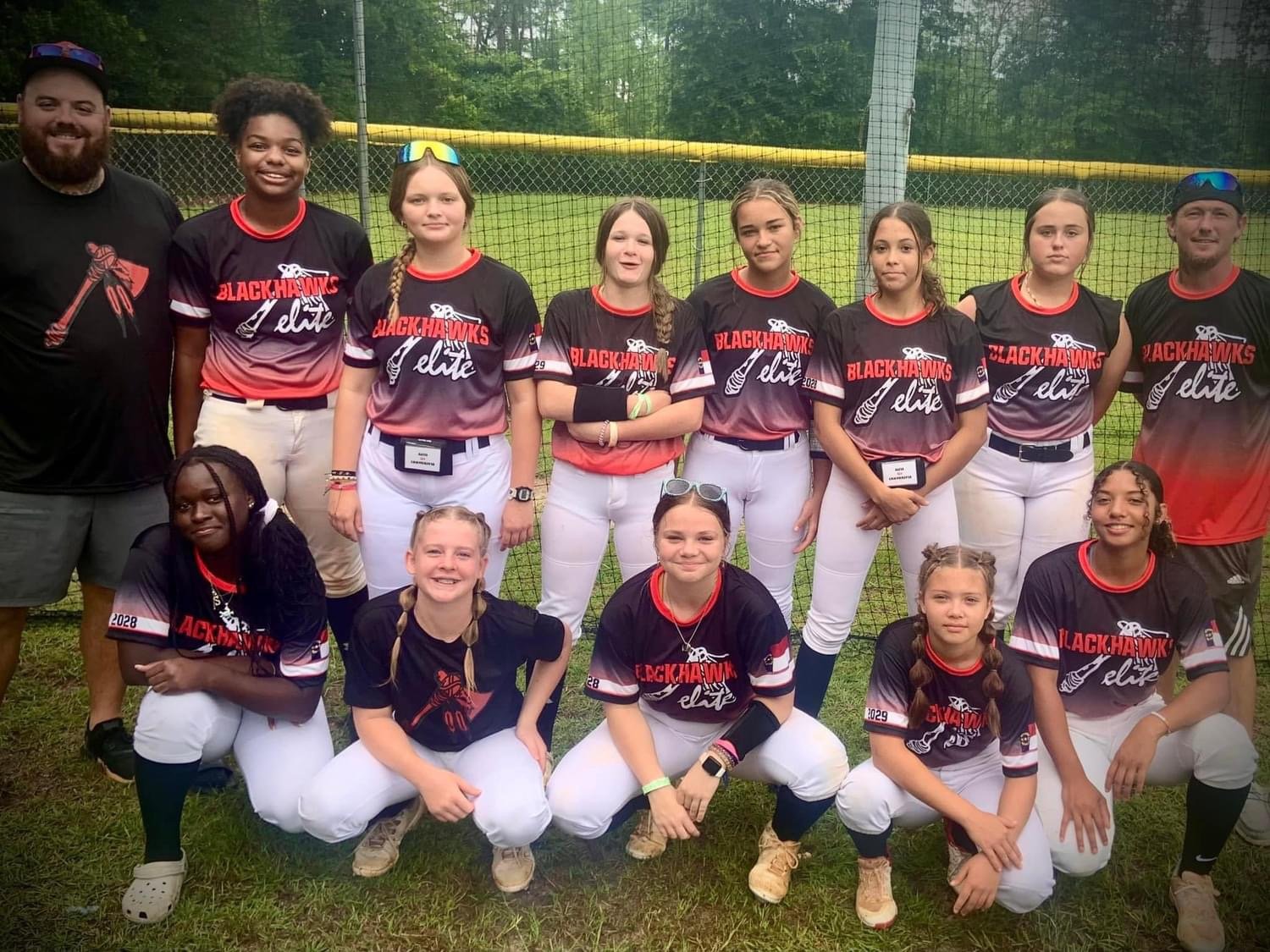 Blackhawks Elite girls softball team in custom red and black Capra uniforms