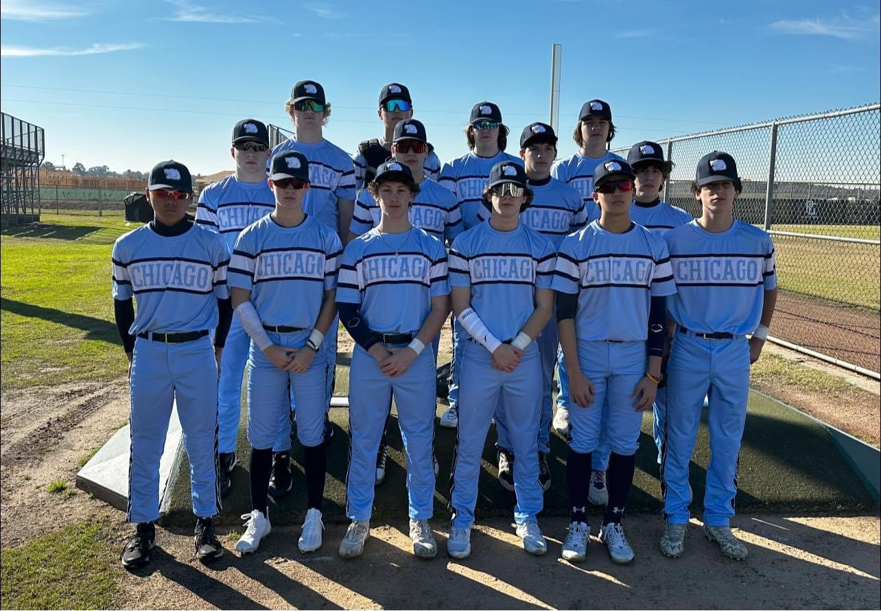 Youth baseball team in custom light blue Chicago Capra uniforms on the field