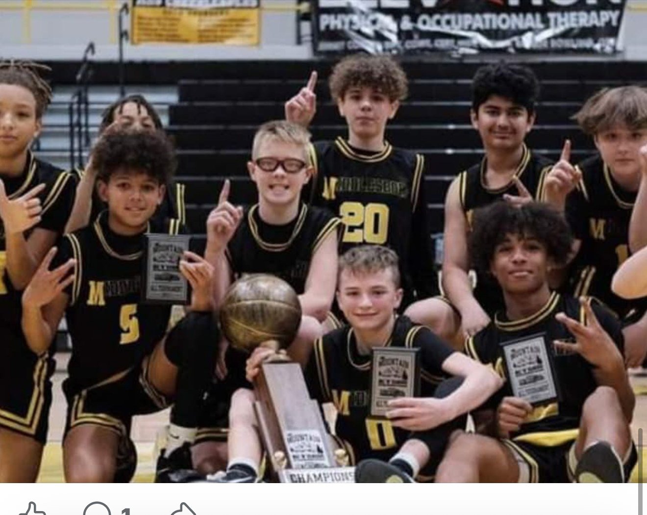 Middlesboro youth basketball champions in custom black and gold Capra uniforms
