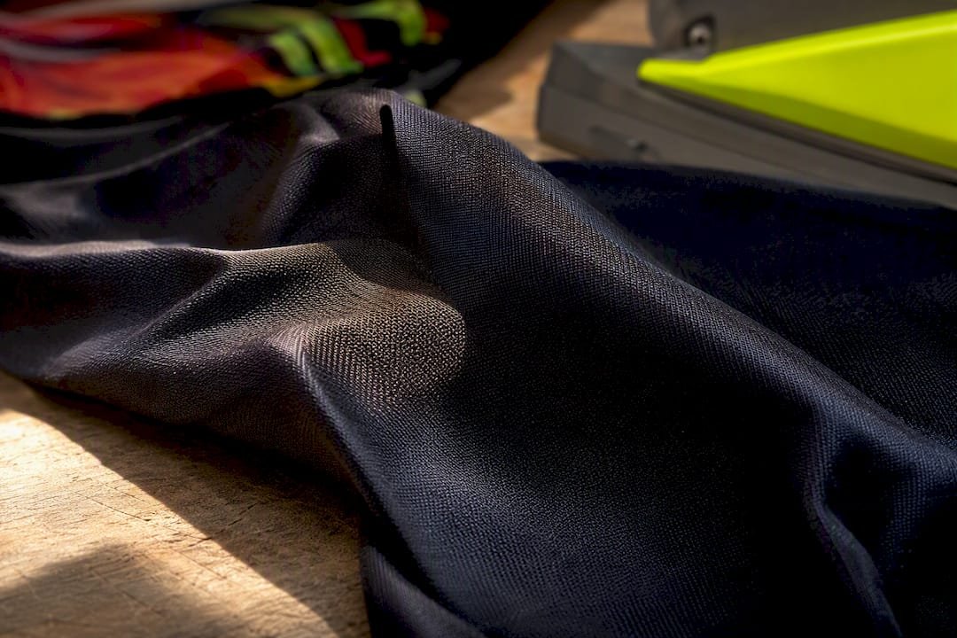 Close-up of dark polyester fabric with sublimation dye tint