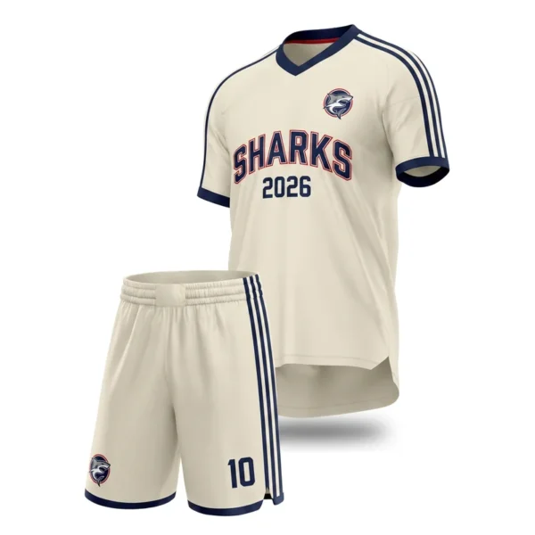 Custom soccer uniform - Sharks shoulder stripes and year wordmark design in cream, jersey and matching shorts, design code CAP-SC-100