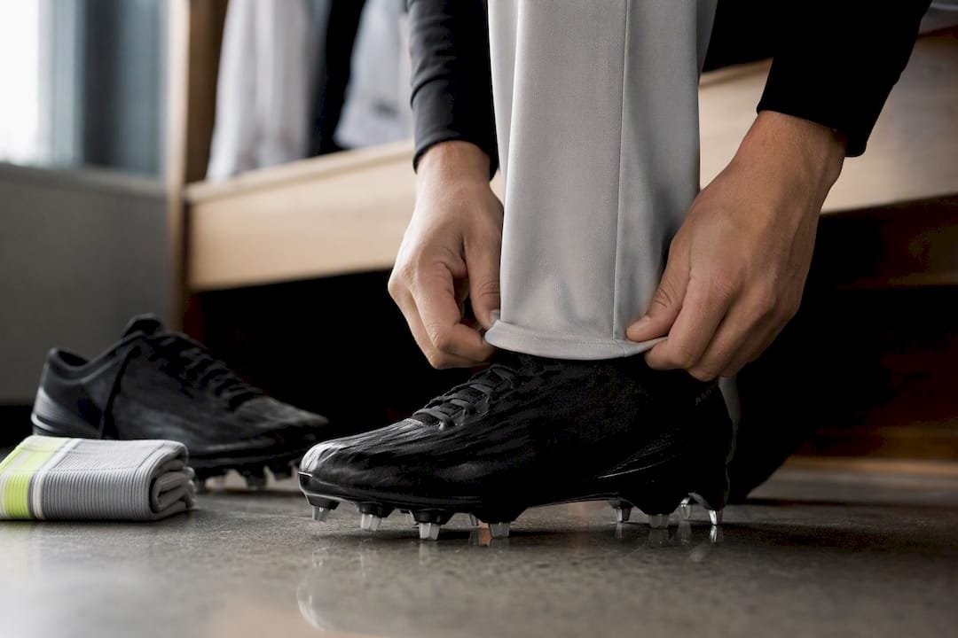 Baseball pant hem beside cleat