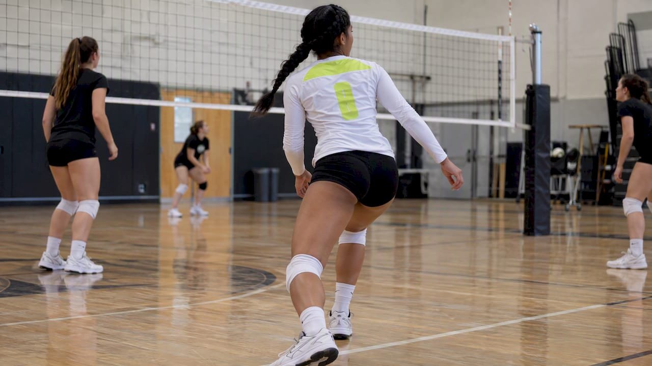 Volleyball player pivoting in fitted jersey