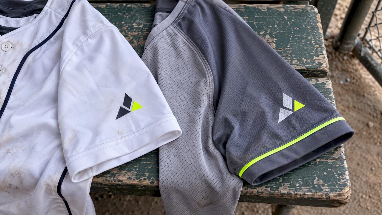 Two jersey sleeve seams with sponsor patches